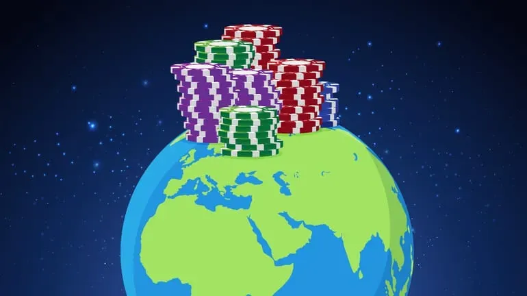 half a globe (Earth) with various stacks of poker chips atop it